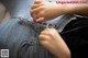 A close up of a woman's hands on a pair of jeans.